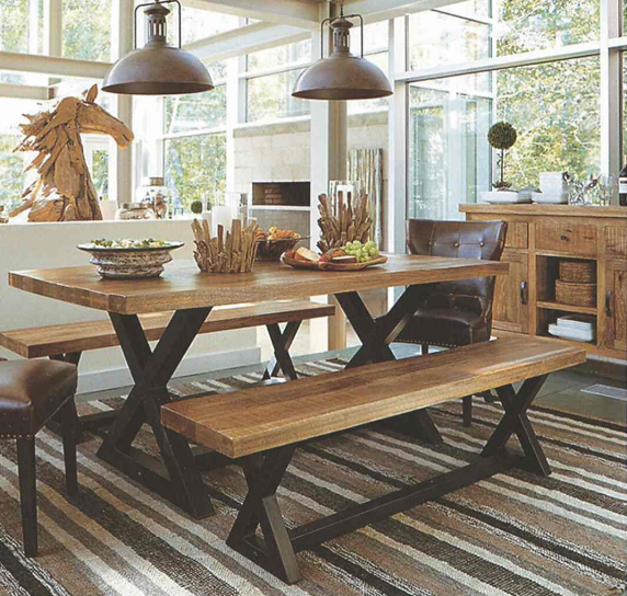 A solid-wood farmhouse dining table with a bench