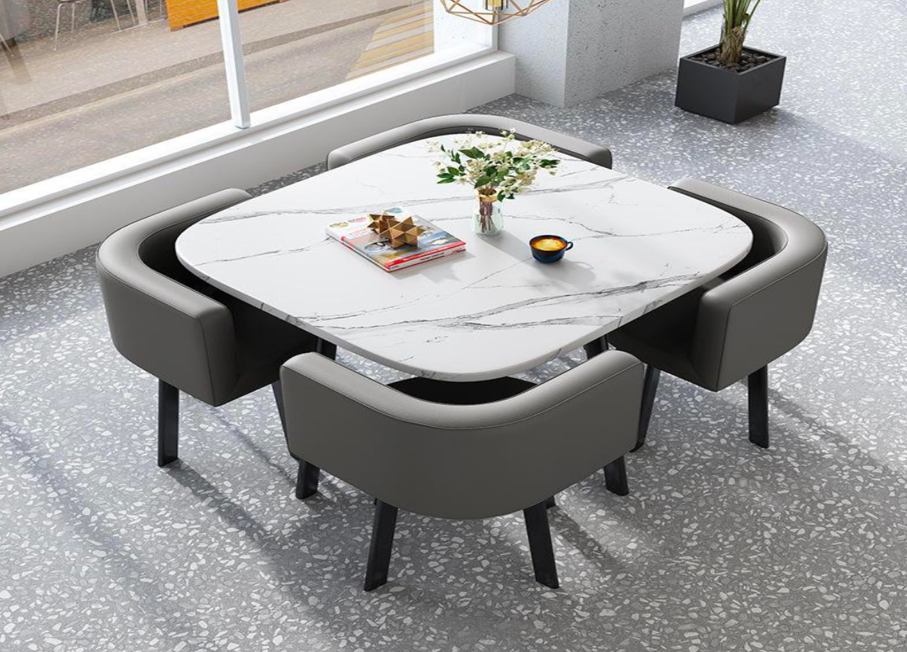 A custom marble dining table set with leather chairs in a sunlit room