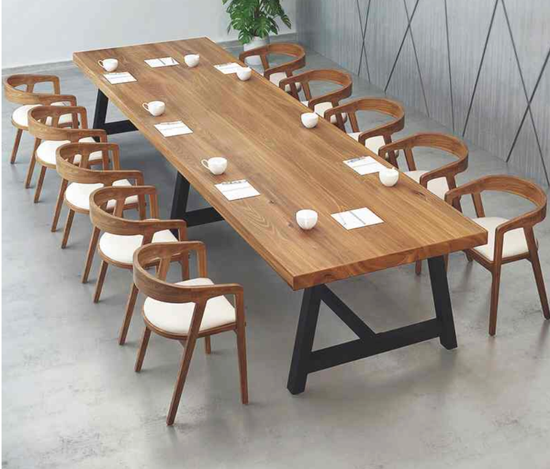 A rustic plank-top dining table with wooden chairs